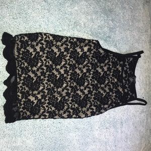 Black lace top w/ front nude underlining .